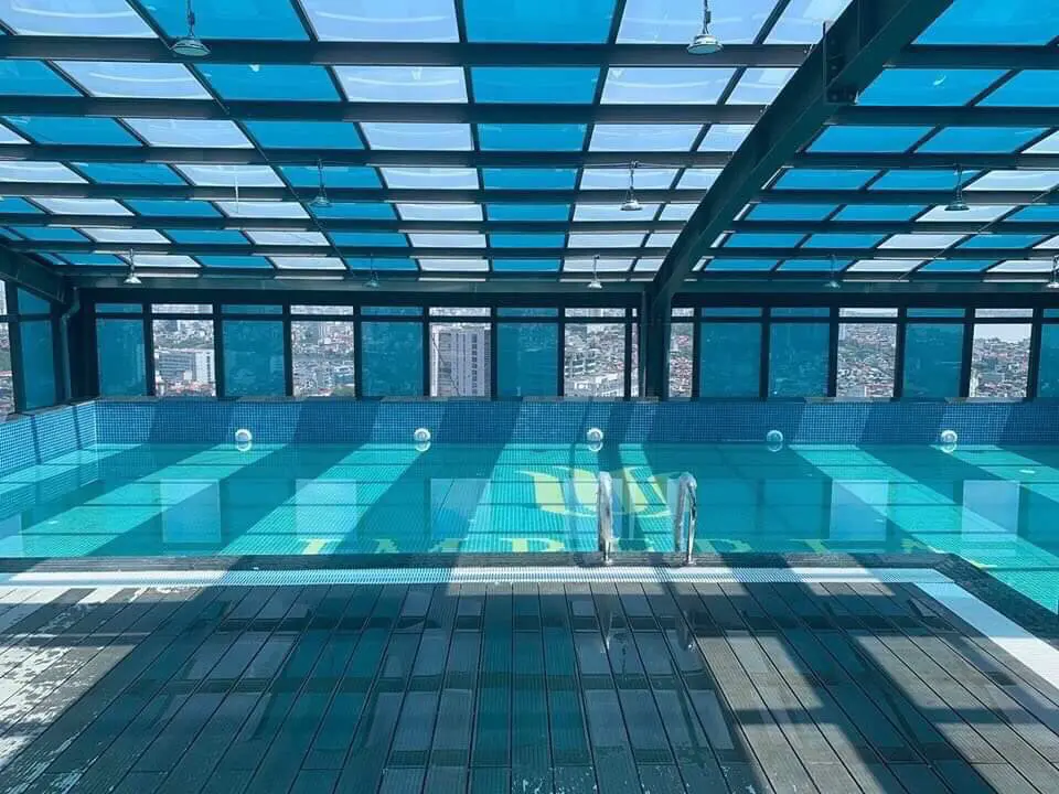 A picture containing building, platform, blue, court Description automatically generated