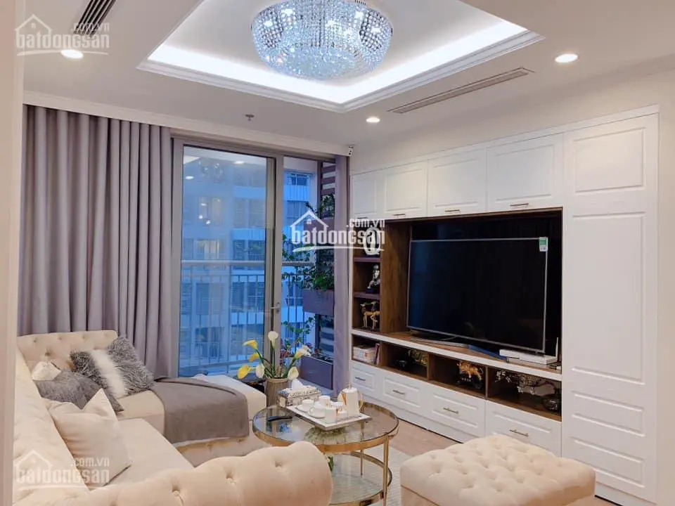 A living room with a large television Description automatically generated with low confidence